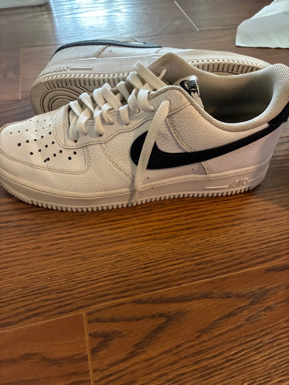 Nike White Low-Top Sneakers with Black Swoosh